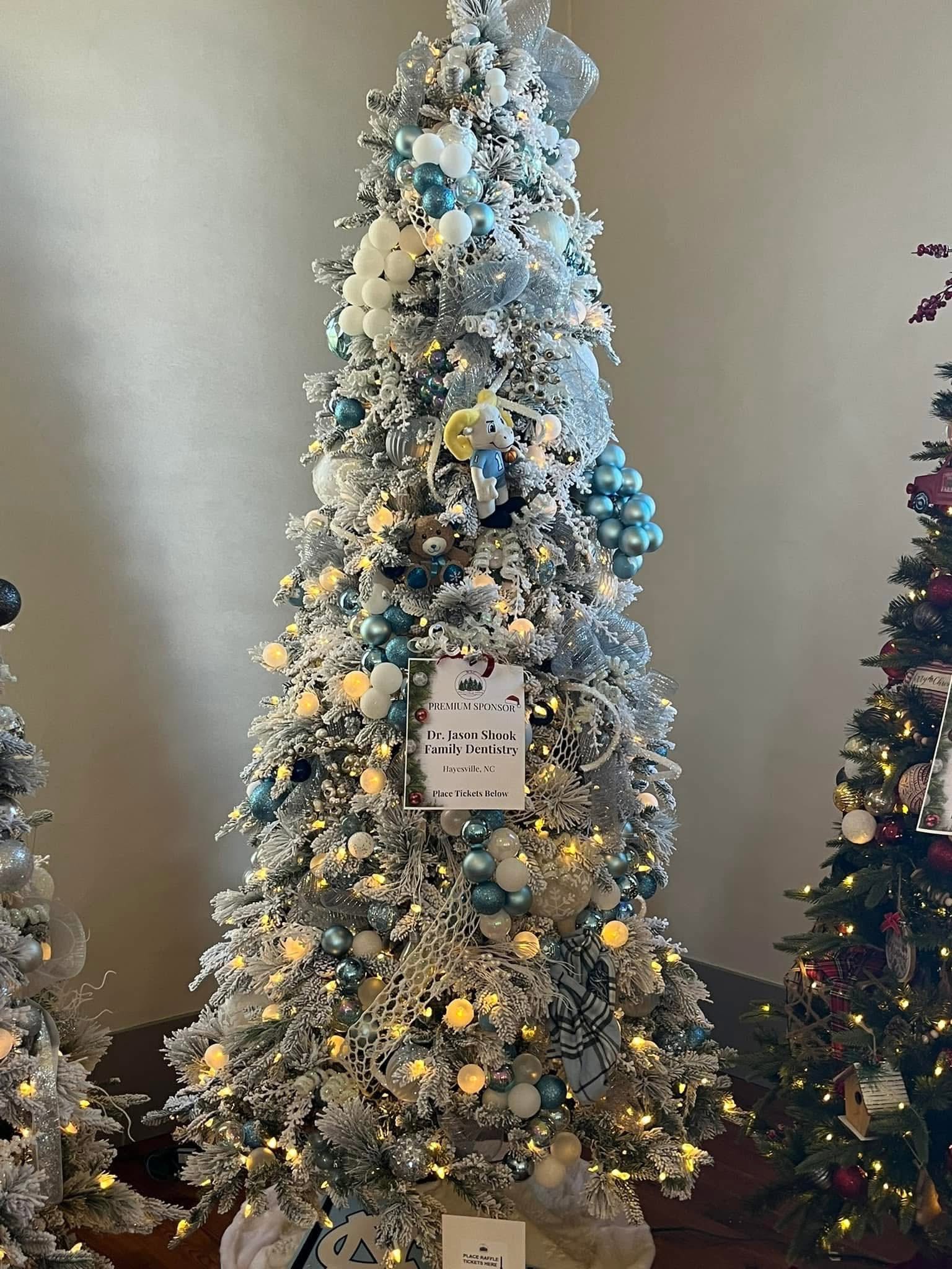 A Carolina-blue and white tree filled with snowy polar bear charm at the WNC Festival of Trees in Hayesville, North Carolina