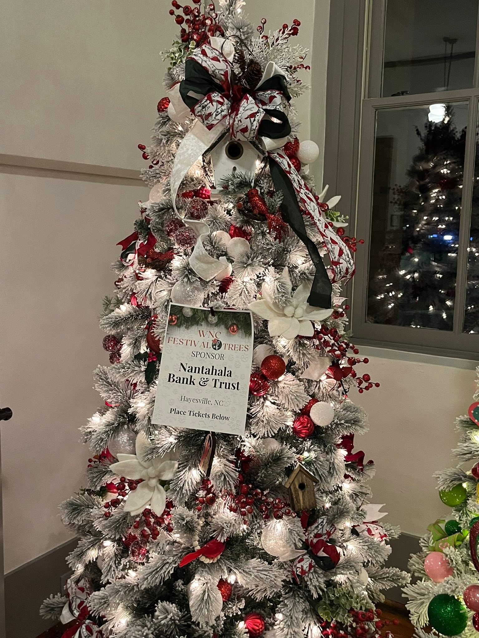 Cardinal-inspired red, white, and evergreen holiday display at the WNC Festival of Trees in Hayesville, North Carolina
