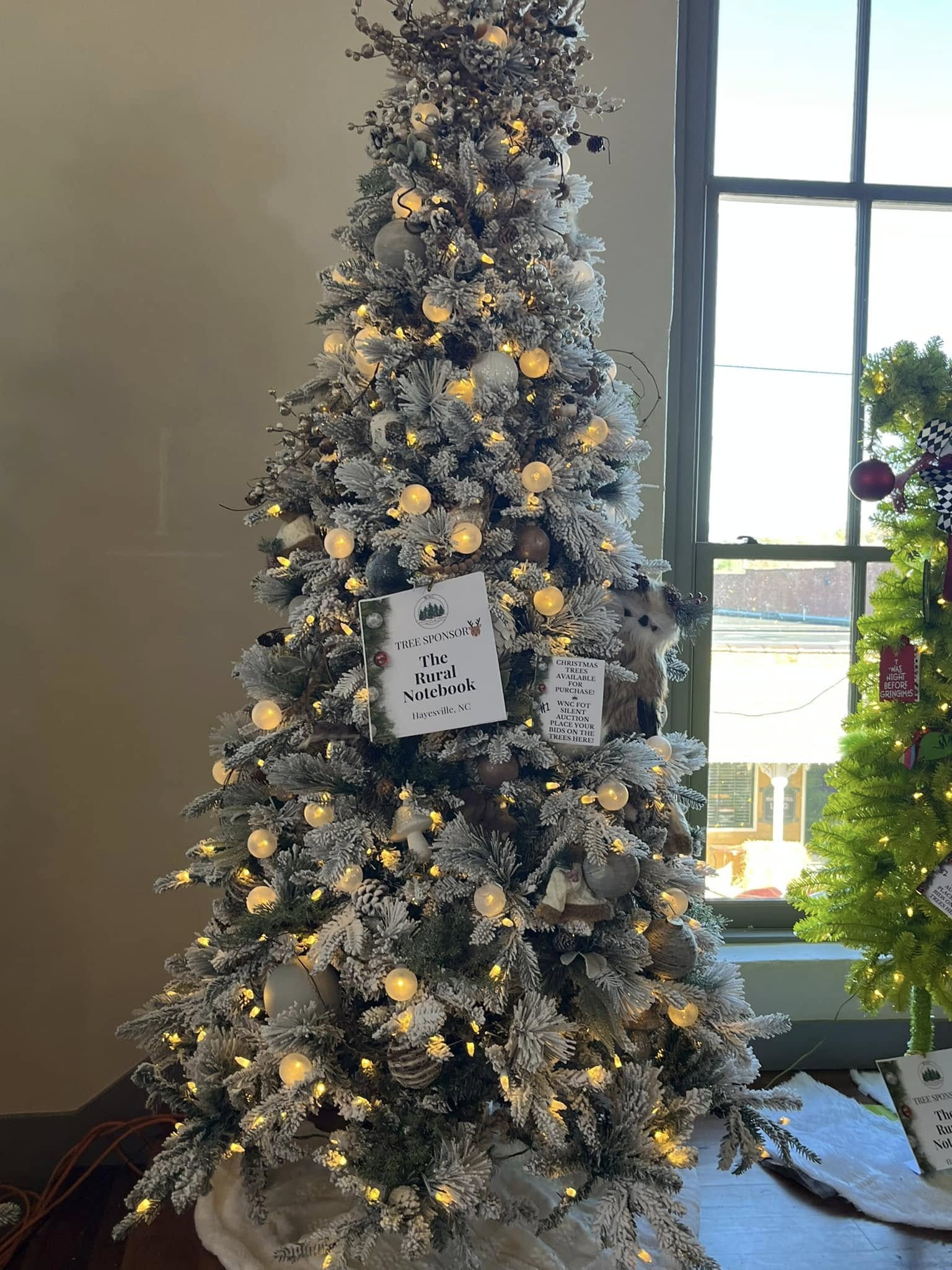 Snowy woodland tree filled with owls and natural textures at the WNC Festival of Trees in Hayesville, North Carolina